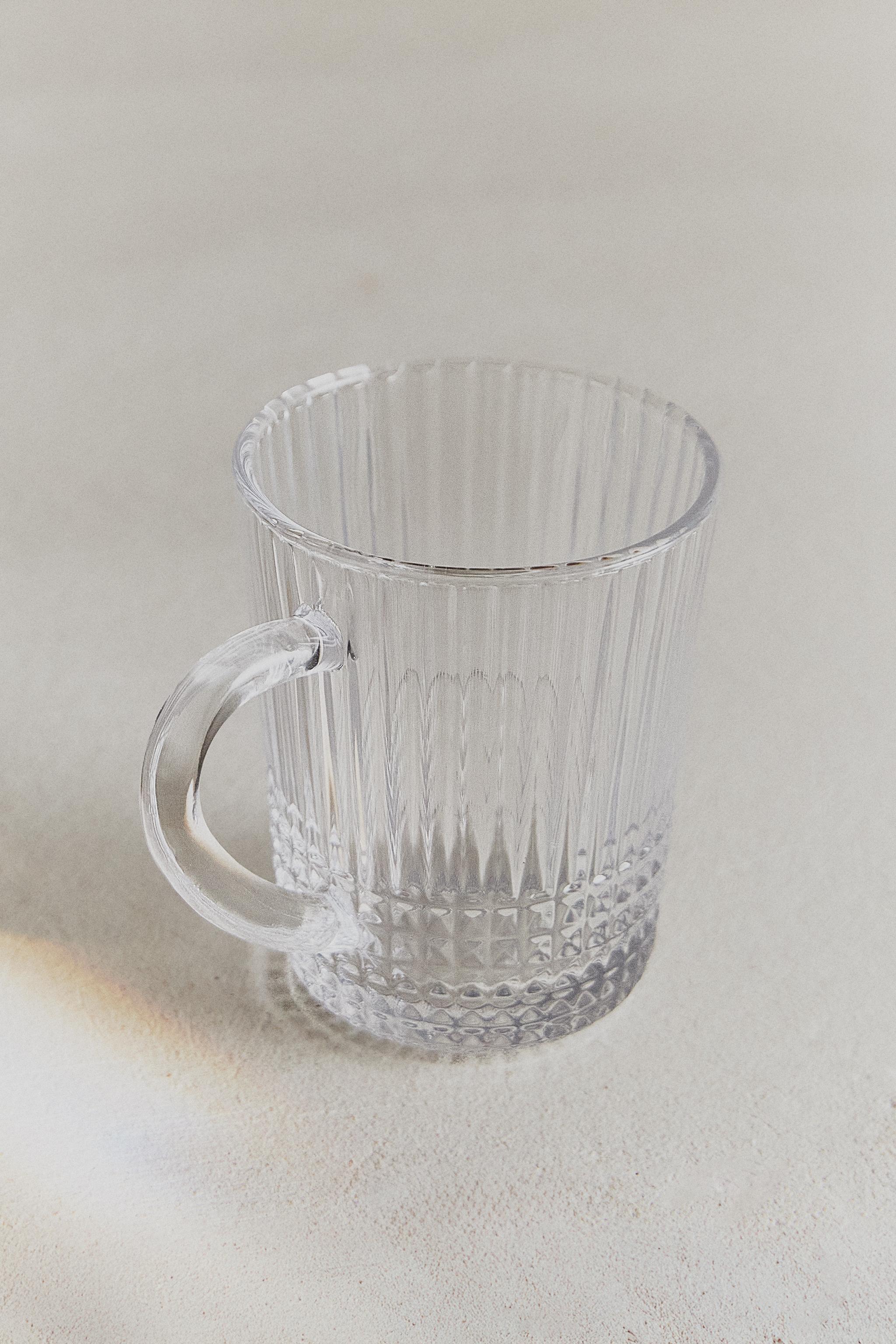 GLASS MUG WITH A RAISED GEOMETRIC DESIGN